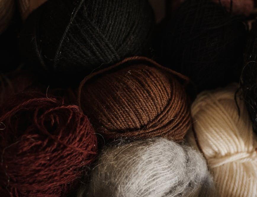 Close Up Photo Of Yarn Rolls With Assorted Colors